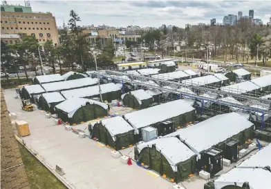  ?? PETER J THOMPSON / NATIONAL POST ?? A tent city has been erected in the parking lot of Toronto's Sunnybrook hospital to handle a surge in COVID-19 cases.