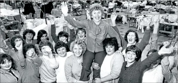  ??  ?? Shop steward Helen Monaghan is raised aloft by her colleagues at the Lee factory in 1981 after their 196-day occupation saved the factory