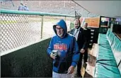  ?? NUCCIO DINUZZO/CHICAGO TRIBUNE ?? Cubs manager Joe Maddon heads back to the clubhouse after the decision to postpone Game 4 due to rain.