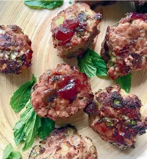  ?? LUCY CORRY ?? Who needs Thanksgivi­ng? These turkey and zucchini meatballs with cranberry glaze are reason enough to celebrate.
