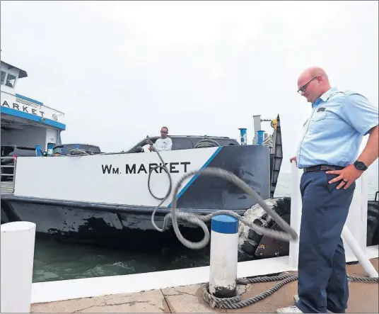  ?? [AMY E. VOIGT /THE TOLEDO BLADE] ?? Jacob Market monitors the docking of one of Miller Boat Line’s ferries at South Bass Island.