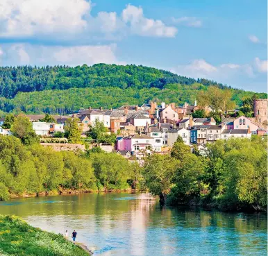  ?? ?? Green and blue: Ross-on-Wye nestles sedately at a bend of the river that leads through some stunning scenery, and past legendary castles, on its way to the Severn Estuary