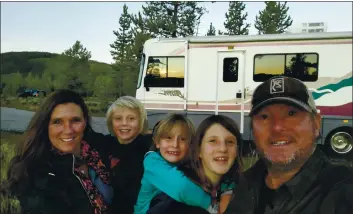  ?? BREAUX WALKER VIA AP ?? Breaux Walker, right, shows his family, from left, Edie Silver Walker, Stokes Walker, Mirakel Walker and Reyne Walker on the banks of the Madison River in Yellowston­e National Park.