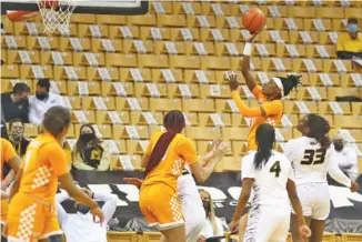  ?? MIZZOU ATHLETICS PHOTO BY HUNTER DYKE ?? Tennessee’s Rennia Davis shoots during Thursday night’s game at Missouri. Davis matched her season high in points with 26 to help the Lady Vols win 78-73 in the SEC matchup.
