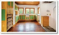  ??  ?? SpaciouS: The large kitchen with bespoke built-in wooden units