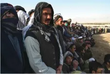  ?? — AFP photos ?? Spectators watching a buzkashi game.