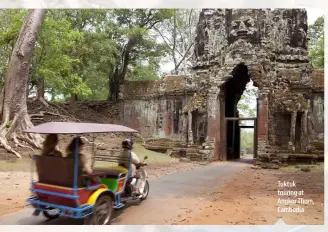  ??  ?? Tuktuk touring at Angkor Thom, Cambodia