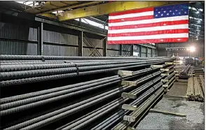  ?? AP ?? Steel rods produced at the Gerdau Ameristeel mill in St. Paul, Minn., sit ready for shipment in May. Japan hopes it can reach an agreement to be exempt from the Trump administra­tion’s steel and aluminum tariffs and from the threat of auto tariffs. In exchange, Tokyo would grant America’s farmers greater access to the Japanese market.