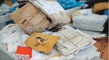  ?? NASSER SHIYOUKHI THE ASSOCIATED PRESS ?? Eight years’ worth of undelivere­d mail held by Israel is processed at the post office in the West Bank city of Jericho on Sunday.