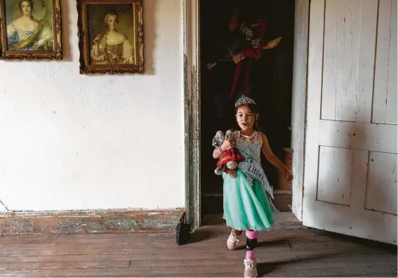  ?? Photos by Lisa Krantz / Staff photograph­er ?? Zoe Zavala, 7, walks through the Polley Mansion after being crowned Honorary Little Miss during the Sutherland Springs Old Town Days Royal Court Presentati­on.