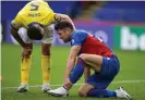  ??  ?? Lewis Dunk checks on Crystal Palace’s Gary Cahill after the lunge that led to a red card for Brighton’s captain. Photograph: Kevin Quigley/Kevin Quigley NMC Pool