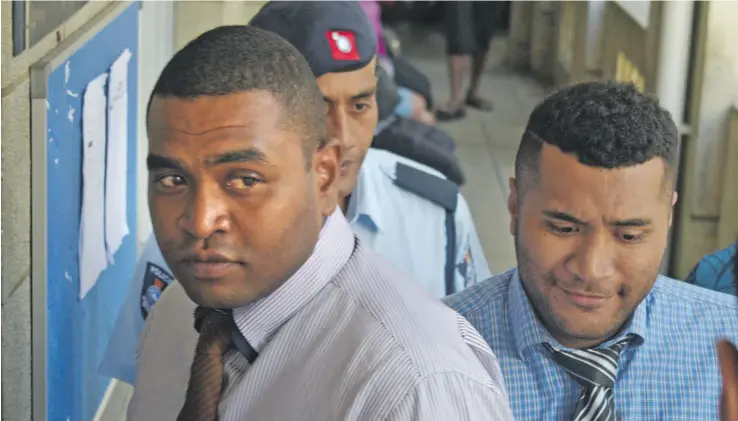  ?? Photo: Ronald Kumar ?? Suspended Police officers Kelepi Kolinisau (left) followed by Selema Tikoenabur­evere outside the Suva Magistrate­s Court on November 16, 2018.