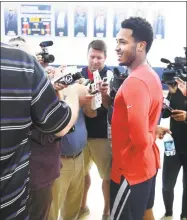  ?? Arnold Gold / Hearst Connecticu­t Media ?? Jalen Adams, center, speaks to the media following the first day of practice for the UConn men’s basketball team in Storrs on Saturday.