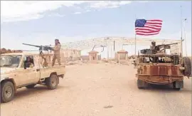  ?? Hammurabi’s Justice News ?? SYRIAN REBELS and U.S. troops guard the Tanf border crossing in south Syria last month. Americans, Syrians, Iraqis and Iranians are all fighting in the area.