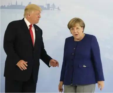  ?? MATTHIAS SCHRADER/THE ASSOCIATED PRESS ?? Stark opposition: Donald Trump’s daily bragging is obnoxious, while Angela Merkel never brags, Judith Timson writes.