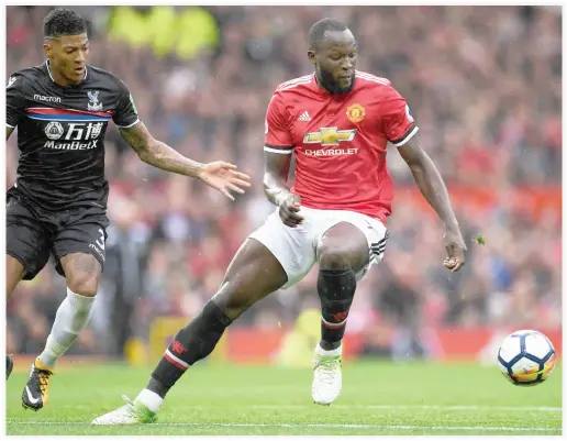  ??  ?? Manchester United’s Belgian striker Romelu Lukaku, right, vies with Crystal Palace’s Dutch defender Patrick van Aanholt during the English Premier League football match between Manchester United and Crystal Palace at Old Trafford in Manchester,...