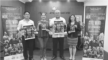  ??  ?? Yii joins Safrina (second left), Ramil (left) and Yip (right) in showing the promotiona­l posters and brochures on Miri AfroLatin Fiesta 2018.