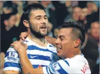 ??  ?? Charlie Austin (left) celebrates scoring QPR’s second goal against Villa with Eduardo Vargas.