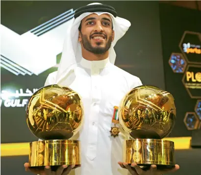  ?? — Photo by Ryan Lim ?? Al Jazira’s Ali Mabkhout with his trophies after winning the Golden Shoe and Emirati Player of the Year awards.