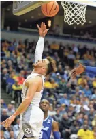  ?? MARK HOFFMAN/ MILWAUKEE JOURNAL SENTINEL ?? Marquette guard Andrew Rowsey goes in for a basket during the first half of the game against Seton Hall Tuesday night.