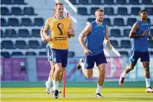  ?? Abbie Parr/associated Press ?? Striker Harry Kane, left, was injured in England’s opening win over Iran but is expected to play against the U.S.