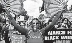  ?? JAHI CHIKWENDIU/THE WASHINGTON POST ?? 2 movements, 1 message: The March for Racial Justice and the March for Black Women held independen­t rallies in Washington, D.C., on Saturday before converging on the Mall as part of an effort to spotlight racial injustices, especially those facing...