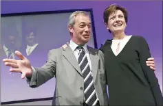  ??  ?? Farage congratula­tes new leader Diane James, at the party’s annual conference in Bournemout­h. — Reuters photo