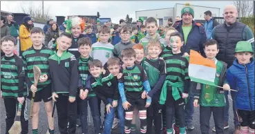  ?? ?? GLENROE HURLERS: Young hurlers from Glenroe GAA and their coaches, preparing to take part in Ballylande­rs St. Patrick’s Day parade. (Pic: John Ahern)