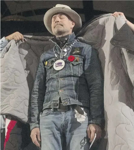  ?? ADRIAN WYLD/THE CANADIAN PRESS/FILES ?? Gord Downie was presented with a star blanket during a ceremony in his honour in 2016 at the Assembly of First Nations special chiefs assembly in Gatineau, Que.