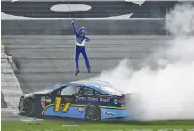  ?? THE ASSOCIATED PRESS ?? Ricky Stenhouse Jr. leaps in celebratio­n after winning the Coke Zero 400 late Saturday night at Daytona Internatio­nal Speedway. It was his second win in Cup Series competitio­n this season.