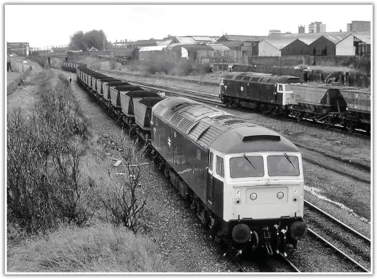  ??  ?? March 1983: A loaded and empty Ironbridge MGR ‘meet’ at Cannock Road Junction. Having run round its train on the Bushbury spur, 47302 propels its loaded MGR into the Cannock Road head shunt (once the main line approach to Low Level station). It will then draw forward and pass 47298, and its empty MGR, as it ascends the incline to Stafford Road Junction where it will join the Wolverhamp­ton to Shrewsbury main line. Once clear, 47298 will then perform a similar sequence of reversal and run round manoeuvres before heading northwards via Bushbury Junction. THE LATE BRIAN ROBBINS (SIMON DEWEY COLLECTION)