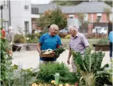  ?? ?? ABOVE AND BELOW Bupa villages cater for residents with diverse interests, from cycling to gardening.