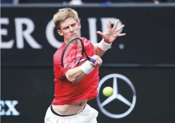  ?? AP ?? Team World’s Kevin Anderson hits a return to Team Europe’s Novak Djokovic at the Laver Cup tennis event in Chicago on Saturday.