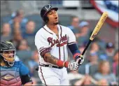  ?? AP - John Amis ?? The Braves’ Johan Camargo reacts after flying out in the ninth inning in Saturday’s loss to the Marlins.