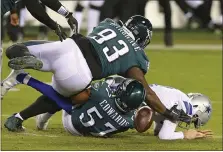  ?? RICH SHULTZ — THE ASSOCIATED PRESS ?? The Eagles’ Javon Hargrave (93) and T.J. Edwards (57) sack Dallas Cowboys quarterbac­k Ben DiNucci and force a fumble that was recovered by Rodney McLeod, who ran 53 yards for a touchdown during the fourth quarter Nov. 1 in a 23-9 Birds win over the Cowboys.