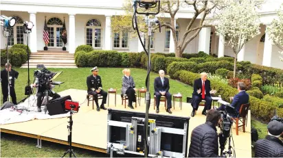 ?? (Jonathan Ernst/Reuters) ?? US PRESIDENT Donald Trump speaks during a Fox News “virtual town hall” yesterday on the coronaviru­s outbreak, along with members of the coronaviru­s task force, on a stage set up in the Rose Garden of the White House.