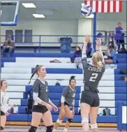  ?? Steven Eckhoff ?? Coosa senior Madison Hill sets the ball for the Lady Eagles during an area match at Armuchee High School on Saturday, Oct. 17.