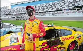  ?? JOHN RAOUX/AP PHOTO ?? Joey Logano stands by his car on pit road before the start of Sunday’s Daytona 500 in Daytona Beach, Fla.