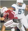 ?? COURANT FILE PHOTO ?? Uconn defensive lineman Travis Jones sacks Umass quarterbac­k Andrew Brito for a 9-yard loss in the fourth quarter of Uconn’s 56-35 win on Oct. 26, 2019, in Amherst, Mass.