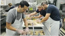  ?? JAMES PARK ?? Volunteers prepare the annual Thanksgivi­ng Dinner.