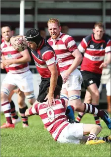  ??  ?? Wicklow’s Barry Hurley collides with and Tullow’s Dylan Leybourne.