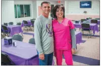  ??  ?? Mickey Shaffer, left, the Poyen girls basketball coach and athletic director, and his wife, Lynn Shaffer, stand together in the hospitalit­y room. Shaffer said the new gym could hold 1,500 people, which is big enough for Poyen to host district and...