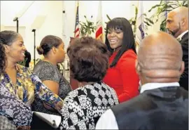  ?? Mel Melcon
Los Angeles Times ?? MAYOR AJA BROWN, in red, has said the ticketed gala around her State of the City speech was simply a way to raise money to support worthy causes.