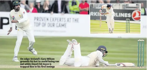  ??  ?? On edge: Ireland’s Gary Wilson grounds his bat to avoid being run out while (inset) Ed Joyce is trapped lbw in his first innings