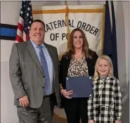  ?? COURTESY OF FOP BERKS LODGE #71 ?? Fleetwood police Officer Angela Arndt poses with Fraternal Order of Police Berks Lodge #71 President Joseph M. Brown and her daughter, Kennedy, after being honored as 2021Police Officer of the Year on Dec. 16, 2021at the FOP social club.