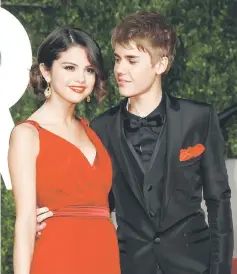  ??  ?? Bieber and Gomez arrive at the 2011 Vanity Fair Oscar party in West Hollywood, California. — Reuters file photo