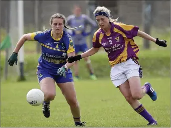  ??  ?? Wicklow’s Aine Byrne and Wexford’s Kellie Kenny in a race for possession.