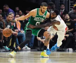  ?? — AP ?? Los Angeles Clippers guard Patrick Beverley (right) reaches in on Boston Celtics forward Jayson Tatum during the second half of an NBA game on Wednesday.