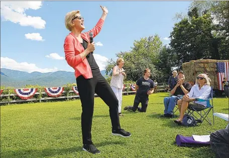  ?? Suzanne Kreiter Boston Globe ?? SEN. ELIZABETH
Warren at a New Hampshire farm last year. “A life as a farmworker should not be a poverty sentence,” her plan says.