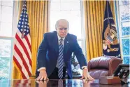  ?? ANDREW HARNIK/ASSOCIATED PRESS ?? President Donald Trump poses for a portrait in the Oval Office in Washington Friday. His administra­tion marks its 100th day in office on Saturday.